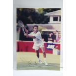 Nine various autographed photographs of tennis players including the signatures of John McEnroe,