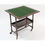 A 1930’s oak combination two-tier tea trolley/card table with fold-over top, & on bobbin-turned