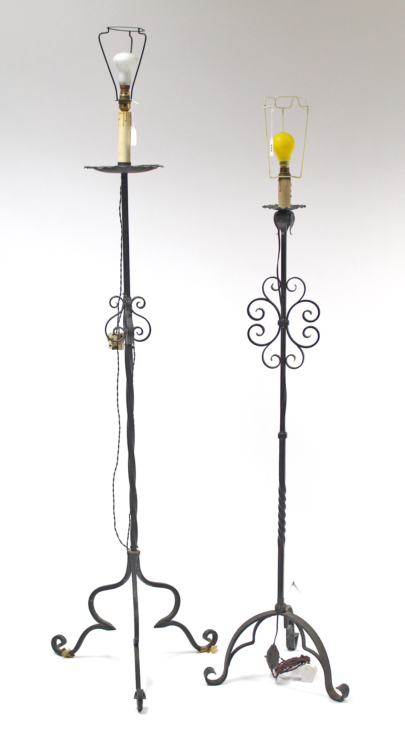 Two wrought-iron standard lamps.