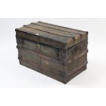 An early 20th century ribbed canvas-covered travelling trunk, 32½” wide (slight faults).
