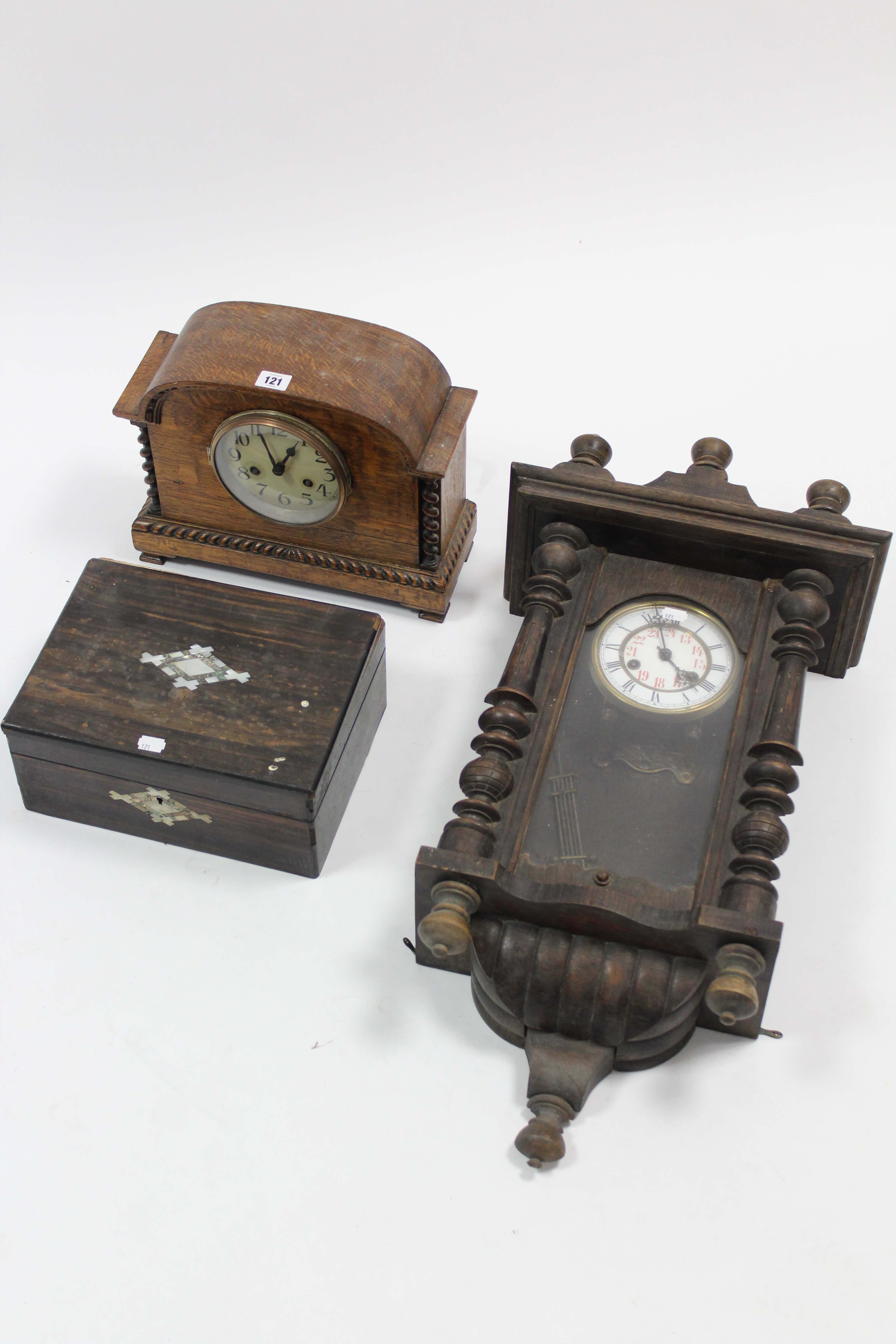 An early-mid 20th century mantel clock with striking movement, & in oak case, 11” high; a 24-hour