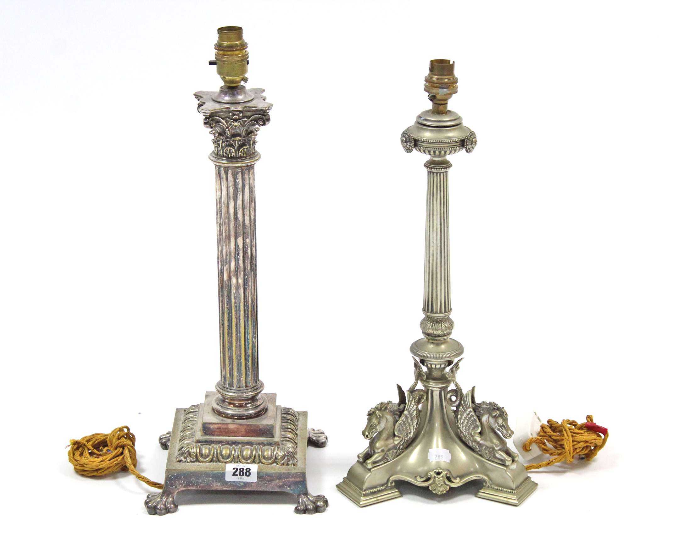 A silver plated Corinthian-style table lamp; & another silver plated table lamp on triform base.