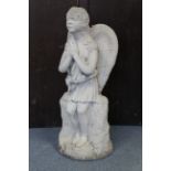 A reconstituted stone garden ornament in the form of a standing angel, 32½ high.