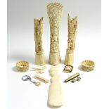 An ivory shoehorn with bust handle; a pair of carved ivory napkin rings; three ivory brooches; &