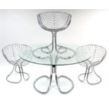 A chrome-finish dining table with plate-glass circular top, 54” diameter; & a ditto set of three