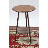 A Victorian mahogany circular two-tier occasional table on three turned & fluted legs, 15” diam.;