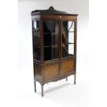 An Edwardian inlaid-mahogany tall china display cabinet fitted two shelves enclosed by pair of