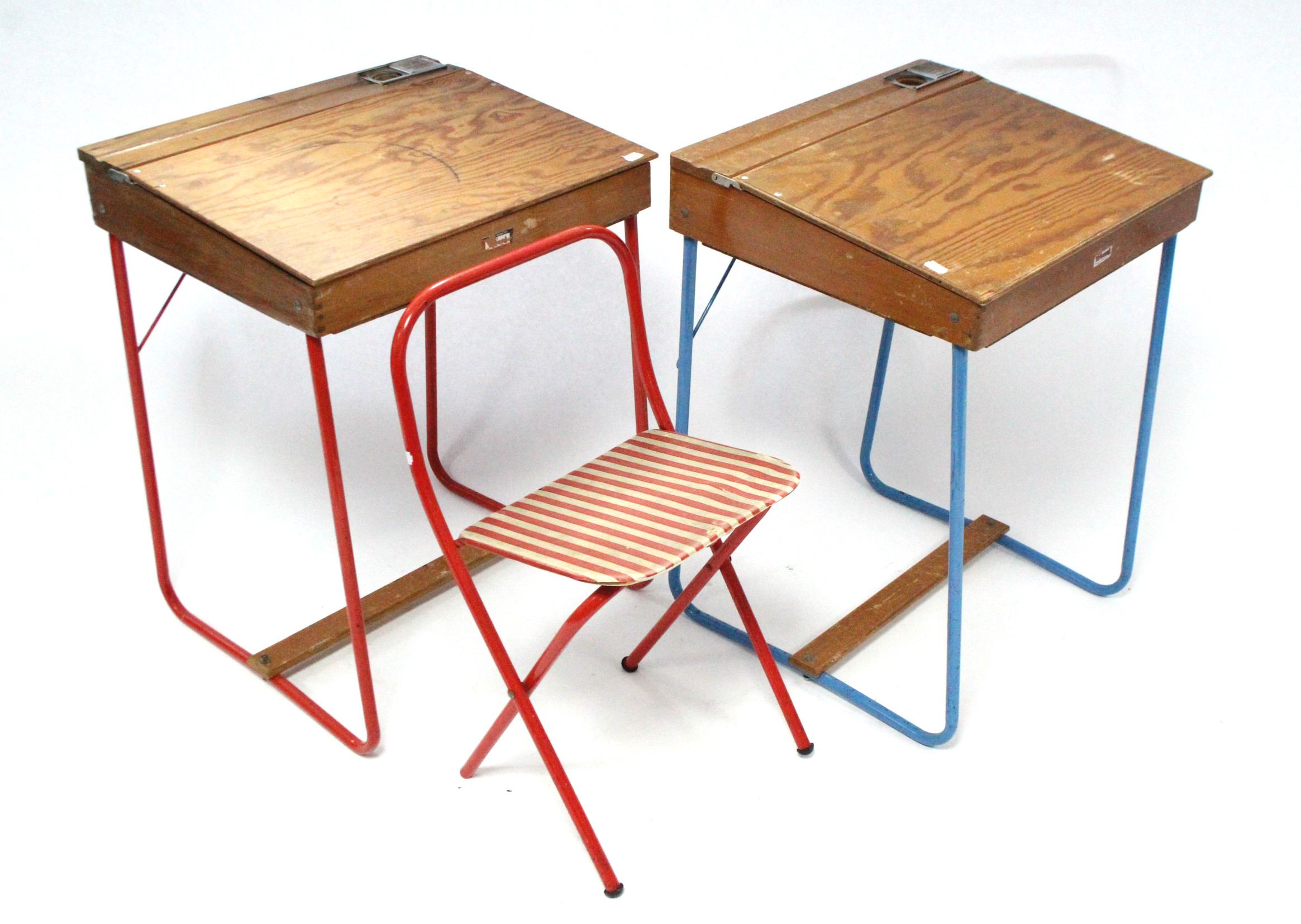 Two Tri-ang tubular-metal & wooden child’s desks; & a tubular-metal folding child’s chair.