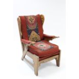 A carved oak frame armchair upholstered Kelim fabric, & on shaped legs with plain stretchers.