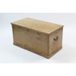 A Victorian-style pine blanket box with hinged lift-lid, with brass side handles, & on plinth