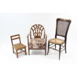 A 1930’s beech low elbow chair; a cane-seat bedroom chair; & a child’s hard seat chair.