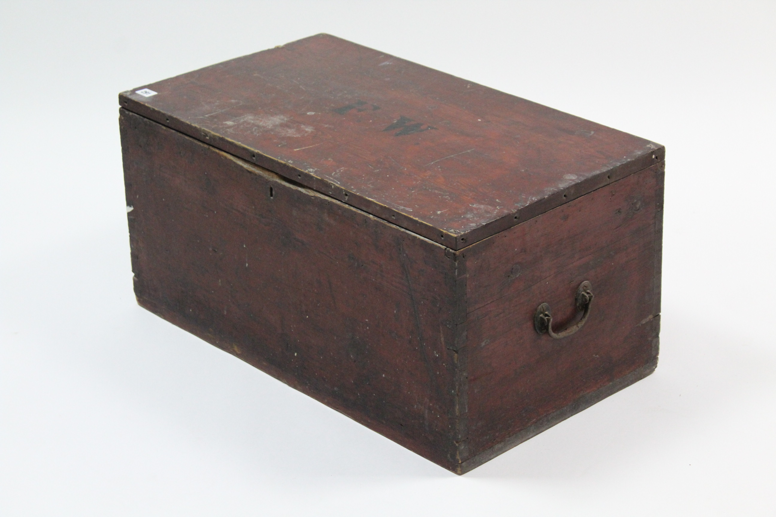 A stained pine tool chest with hinged lift-lid, & wrought iron side handles, 30” wide x 14½” high.