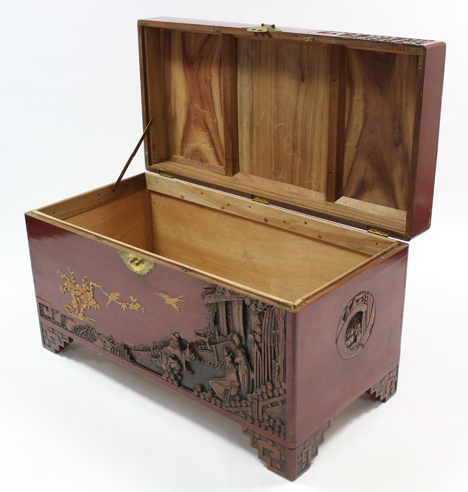 A Chinese camphor wood chest with carved figure scene decoration to the hinged lift-lid, front, & - Image 2 of 2