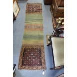 A Persian pattern rug of crimson & ivory ground & with multi-coloured geometric design to centre