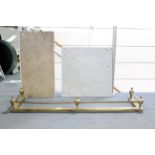 A brass fire-curb, 52” long; & two marble slabs.