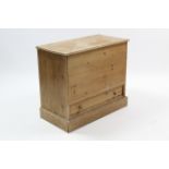 A pine storage box with hinged lift-lid above a long drawer, & on plinth base, 35” wide x 31” high.