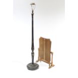 A black & gold lacquered wooden standard lamp with shade; & an oak folding screen/occasional table.