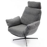 A modern black-finish swivel easy chair with cushions.