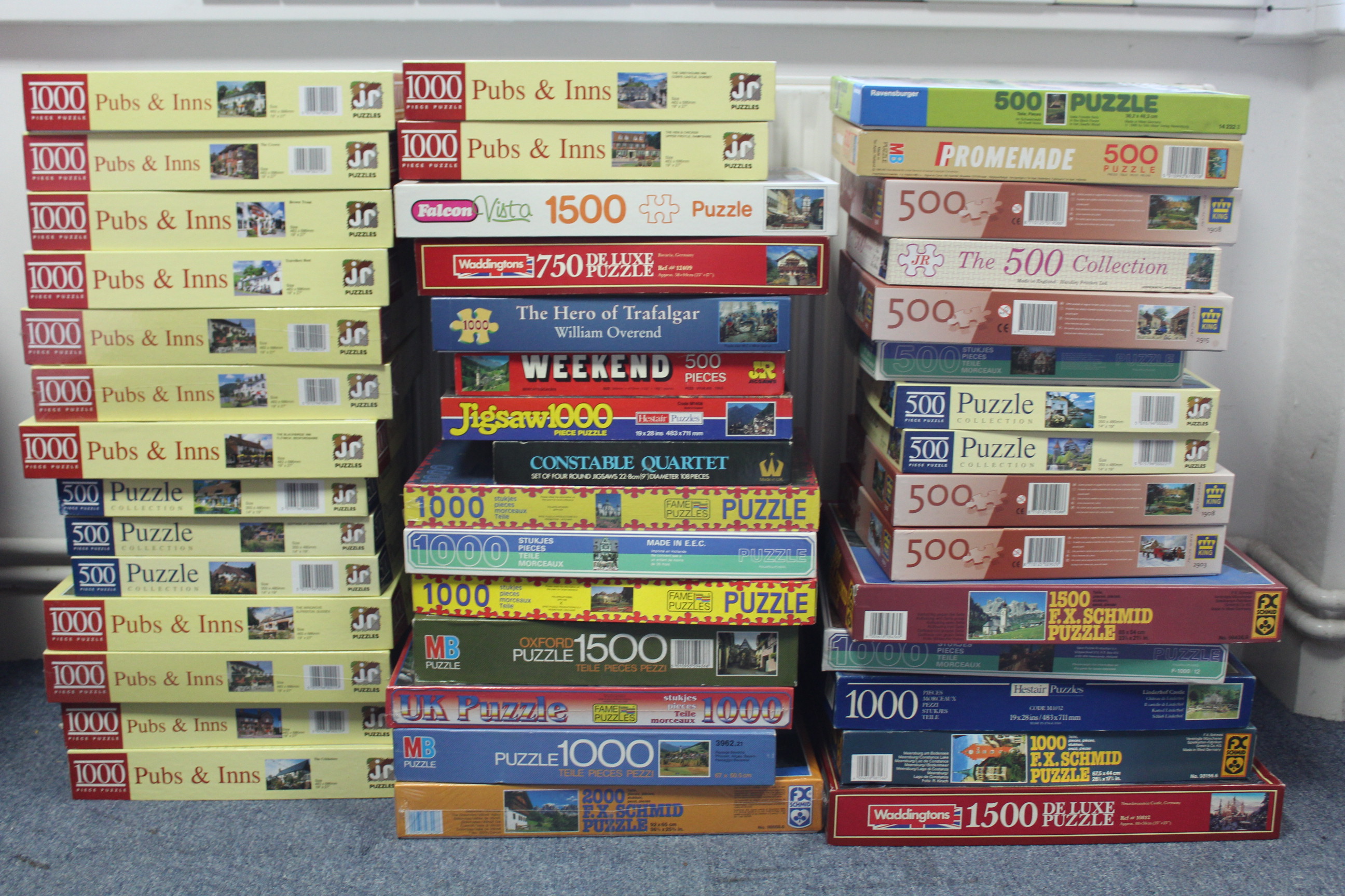 Approximately eighty various jig-saw puzzles, all boxed, some as new.