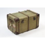 An early-mid 20th century canvas-covered & leather-bound travelling trunk with hinged lift-lid &