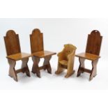 A set of three pine occasional chairs with hard seats, & on X-shaped end supports; & a pine doll’s