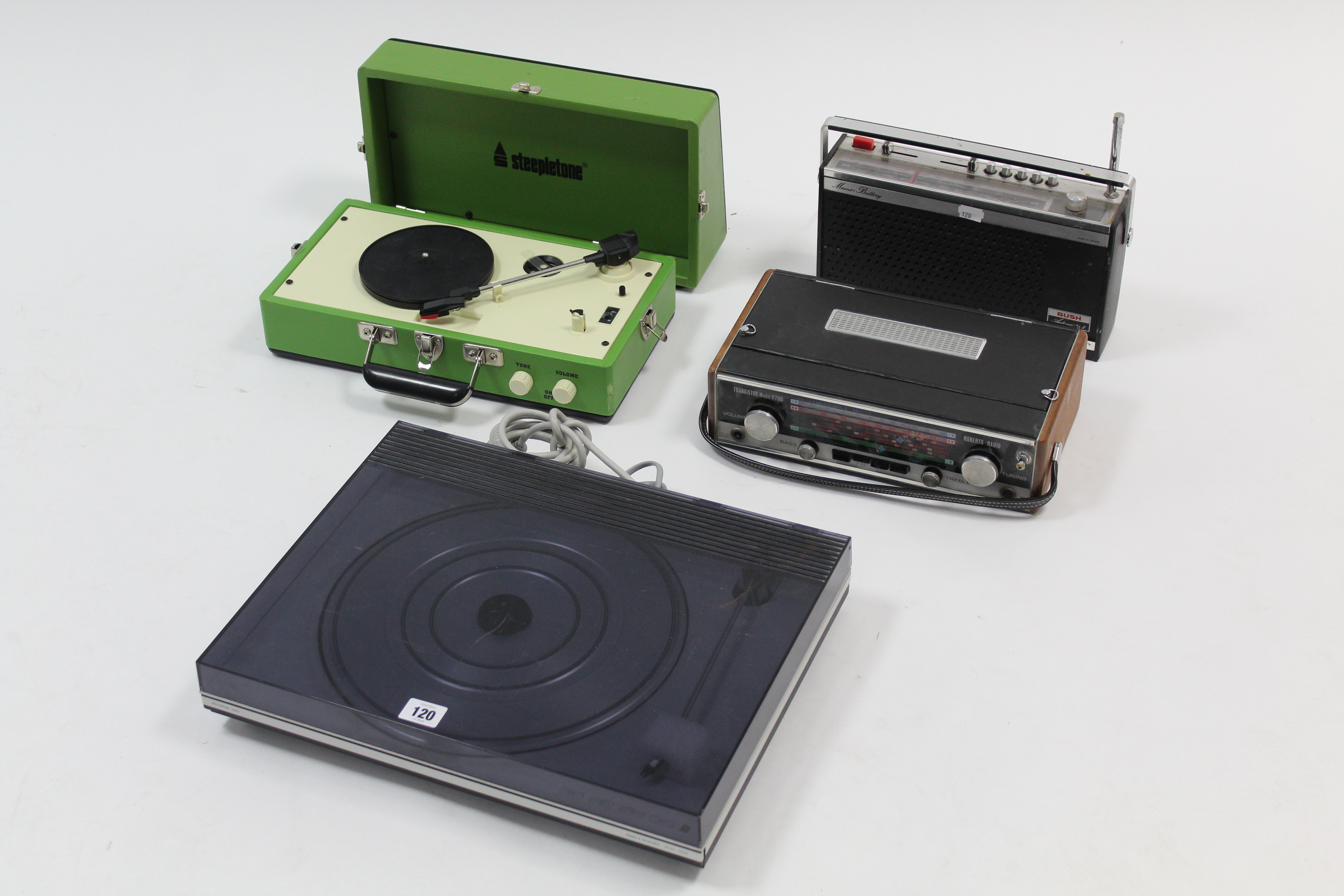 A Bang & Olufsen “Beogram 2000” turntable; a Steepletone portable record player; & two transistor