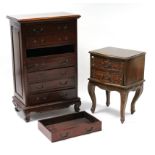 A reproduction oriental-style mahogany finish upright chest, fitted seven long drawers, & on short