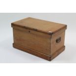 A pine small travelling trunk with hinged lift-lid, & wrought-iron side handles, 27¼” wide x 15½”