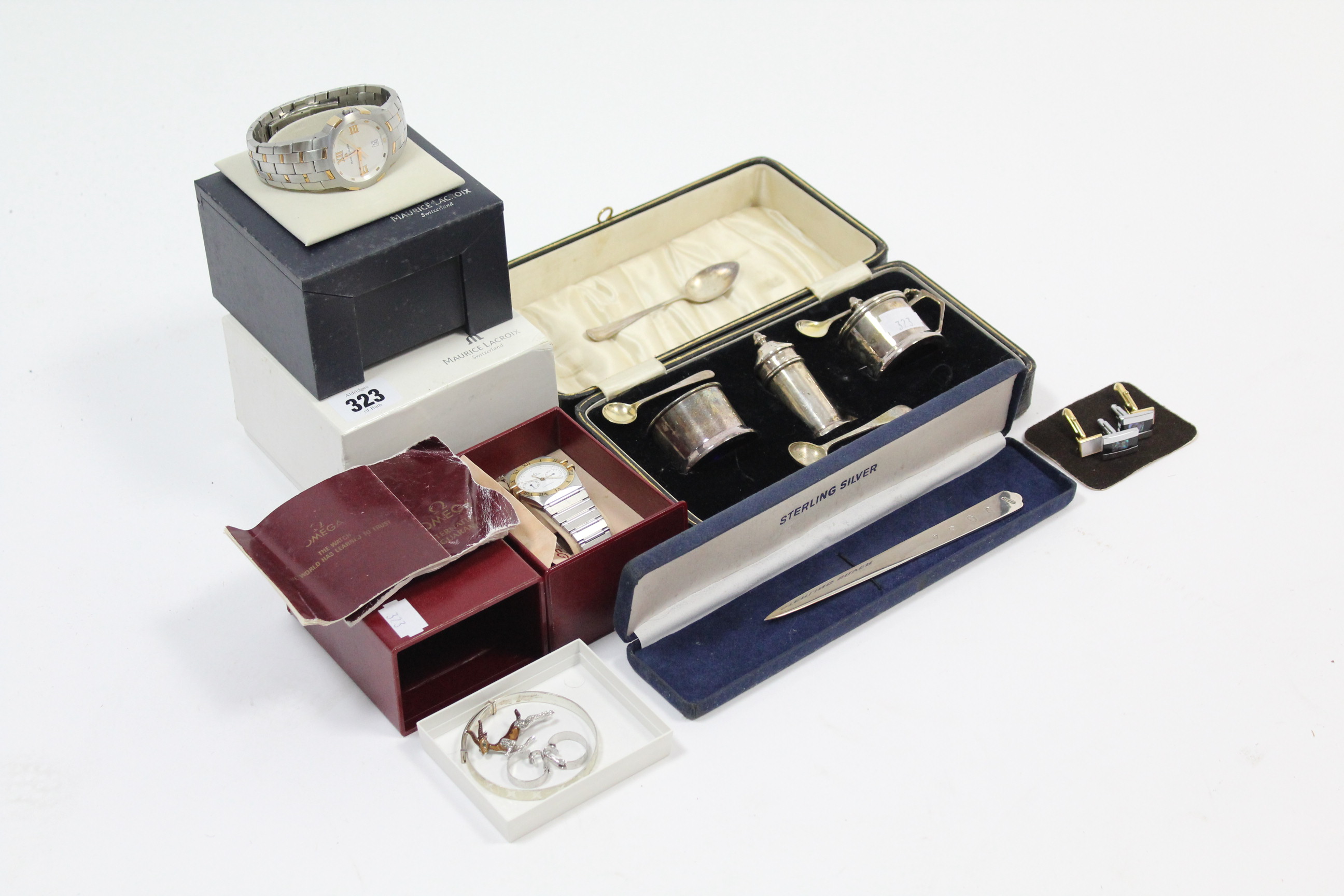 A Sterling silver letter opener; a plated three-piece condiment set; two gent’s wristwatches; &