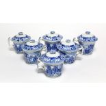 A set of six early 19th century blue transfer custard cups & covers, each decorated with scenes from