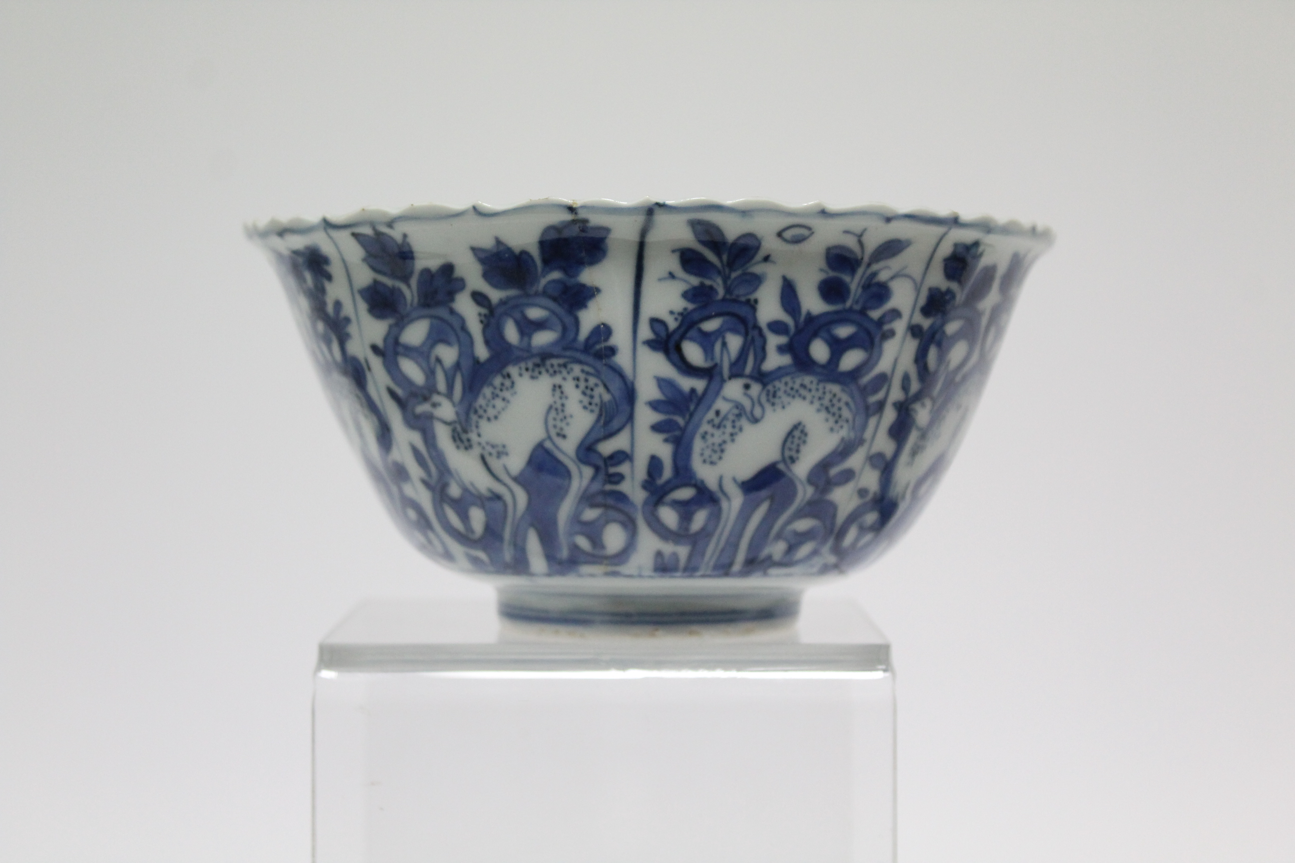 A Chinese blue & white porcelain deep bowl with lotus rim, painted with panels of deer amongst - Image 9 of 24