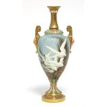 A ROYAL WORCESTER PORCELAIN TWO-HANDLED VASE, the slender ovoid body painted with swans in flight by