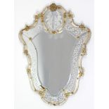 A VENETIAN GLASS SHIELD-SHAPED WALL MIRROR, with etched floral decoration & peacock motif to the