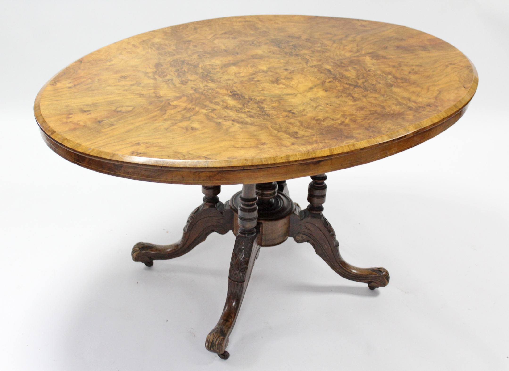 A mid-Victorian burr-walnut loo table with quarter-veneered oval top, on four slender supports - Image 3 of 4