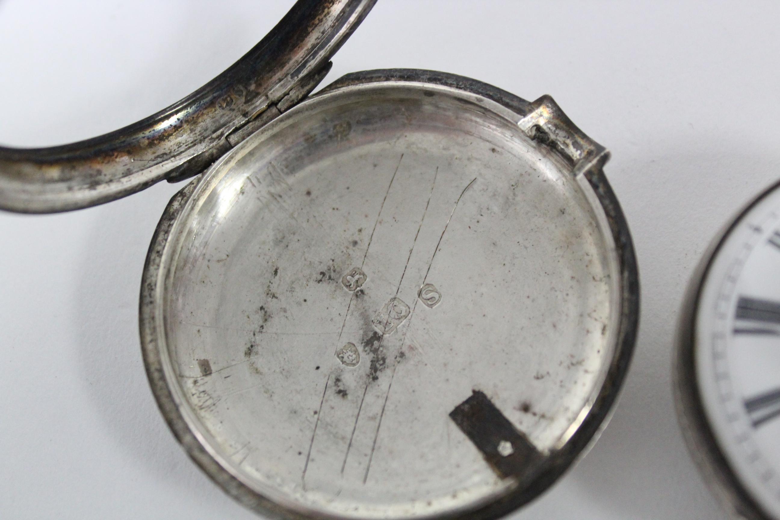 A George III silver pair-cased pocket watch with black roman numerals to the white enamel convex - Image 5 of 11