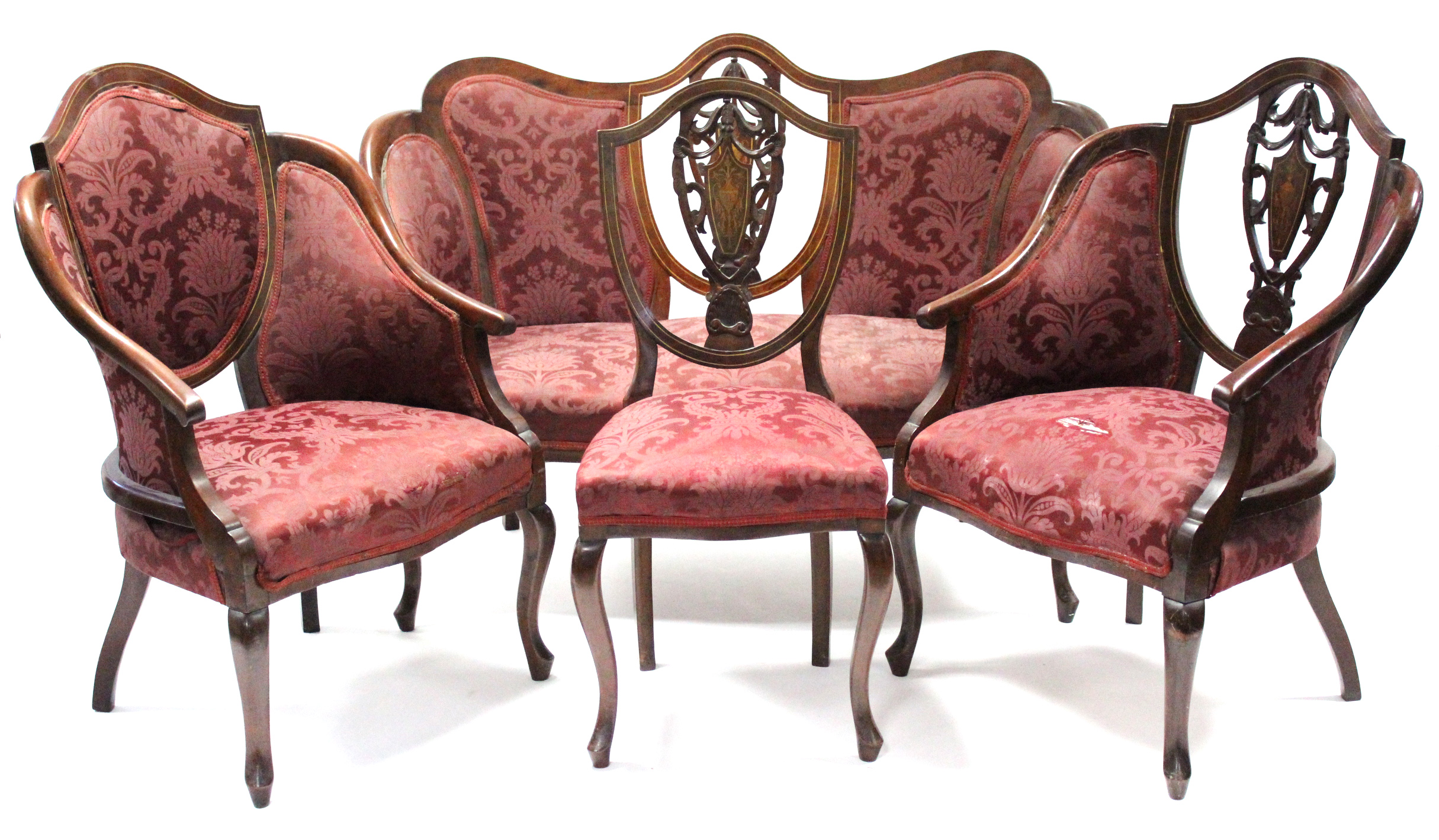 A late Victorian inlaid mahogany seven-piece salon suite comprising: a sofa, two armchairs & four