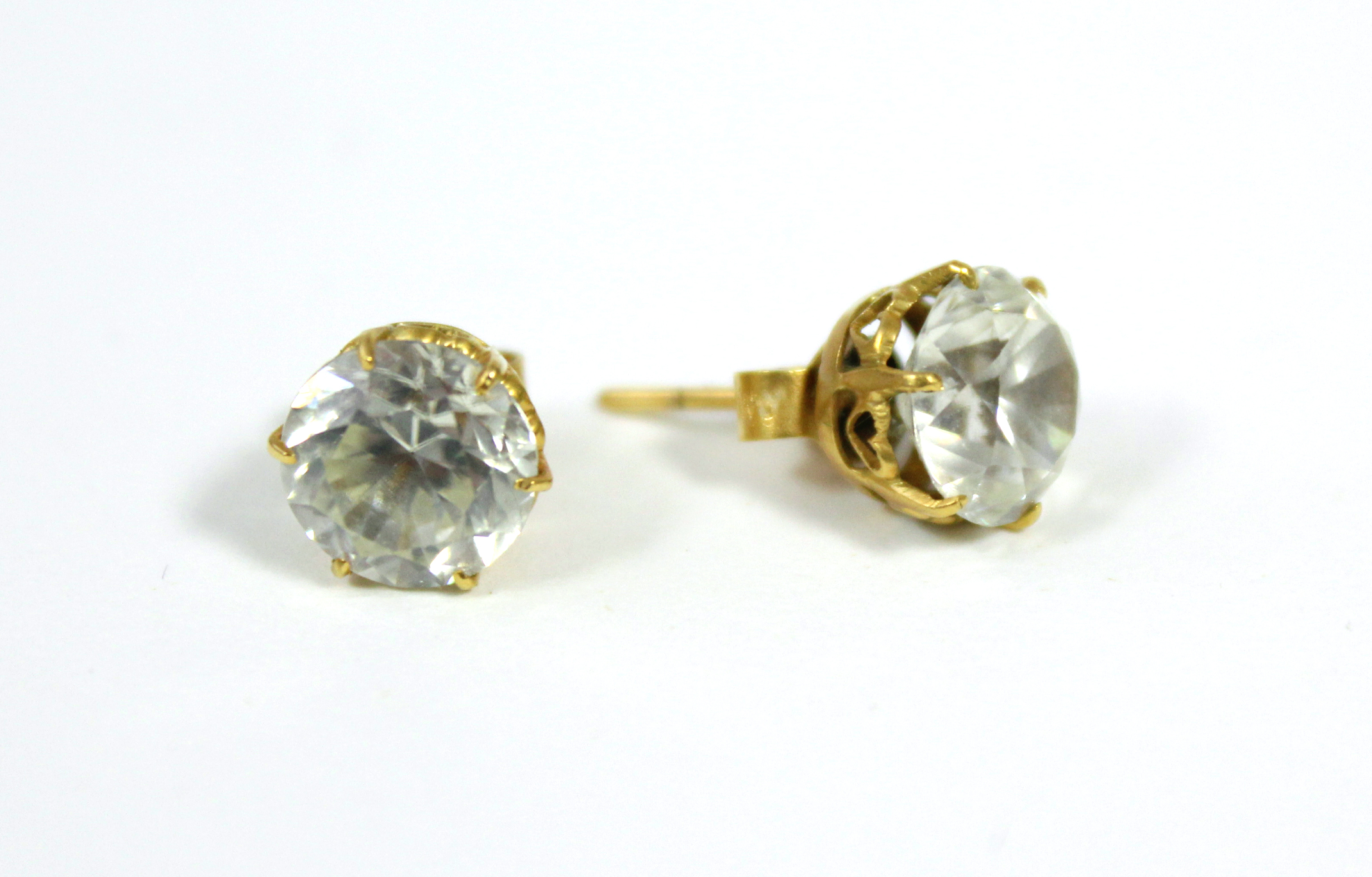 A pair of white topaz ear studs.