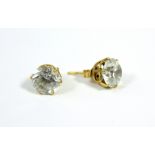 A pair of white topaz ear studs.