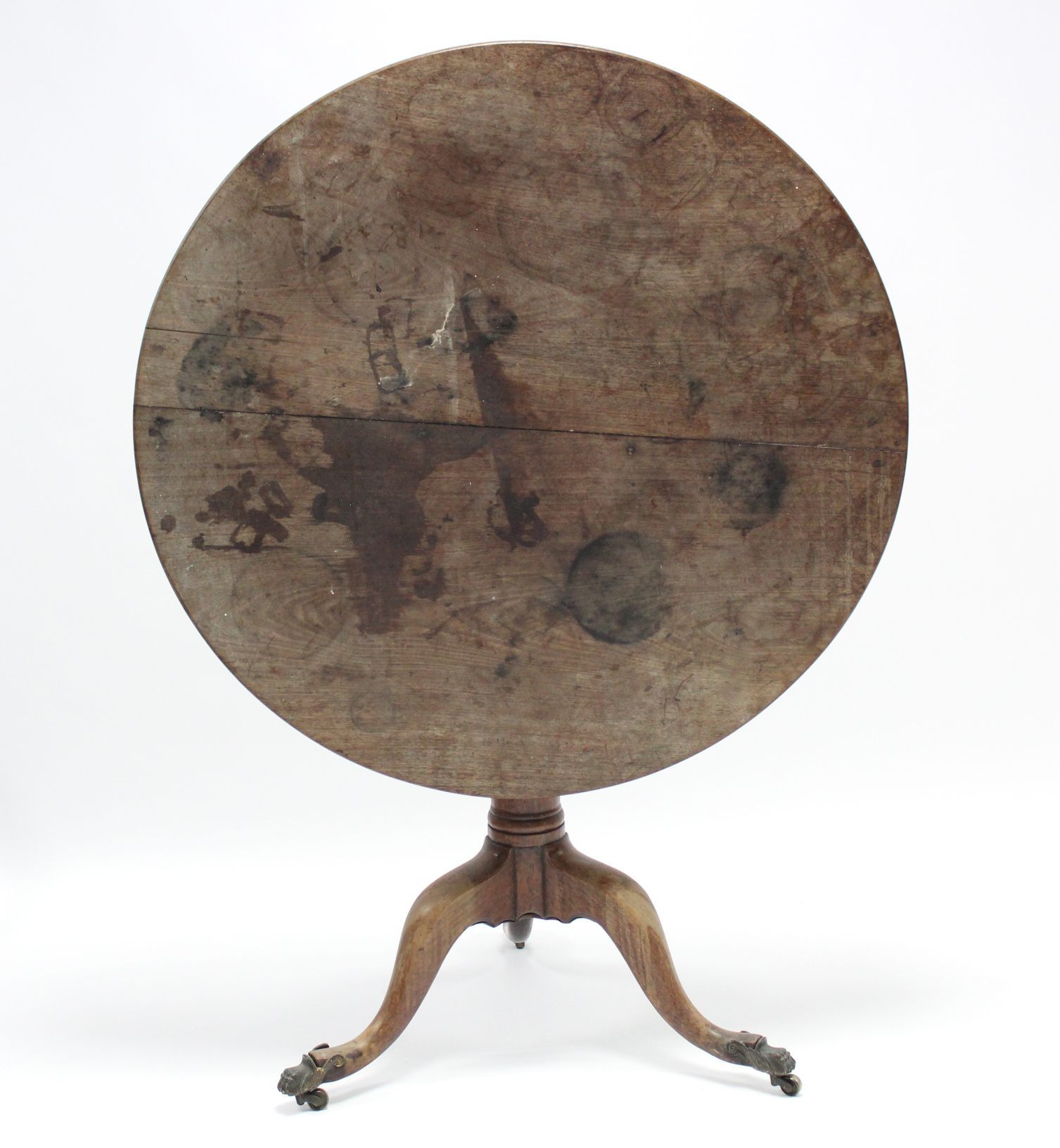 A 19th century mahogany circular tilt-top dining table on tapered centre column & three