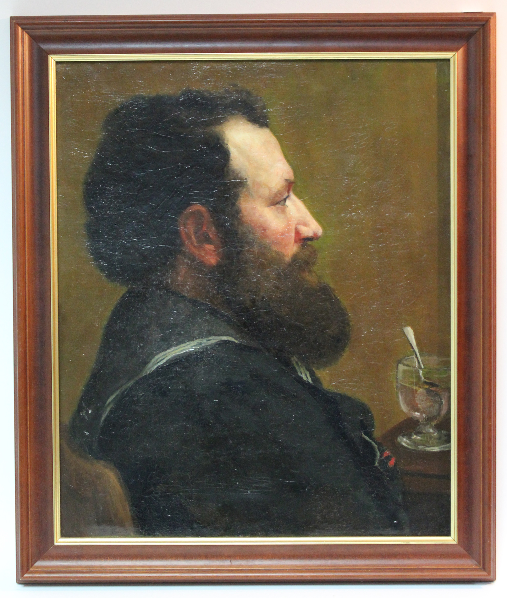 ENGLISH SCHOOL, mid-19th century. A head-&-shoulders portrait of a sailor seated beside a table with