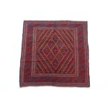 A Kazak rug of crimson & blue ground with central repeating lozenge design within multiple