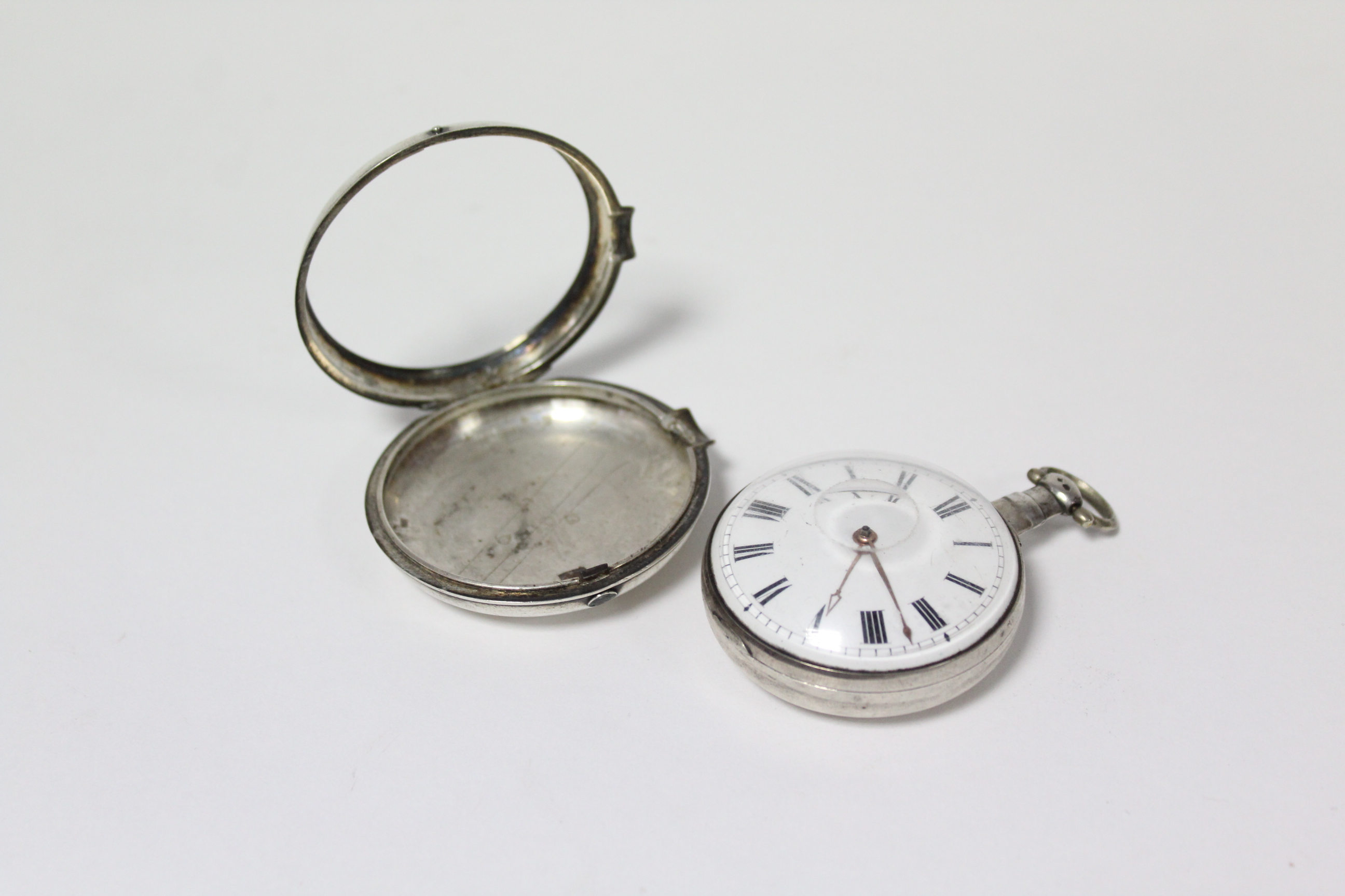 A George III silver pair-cased pocket watch with black roman numerals to the white enamel convex - Image 4 of 11