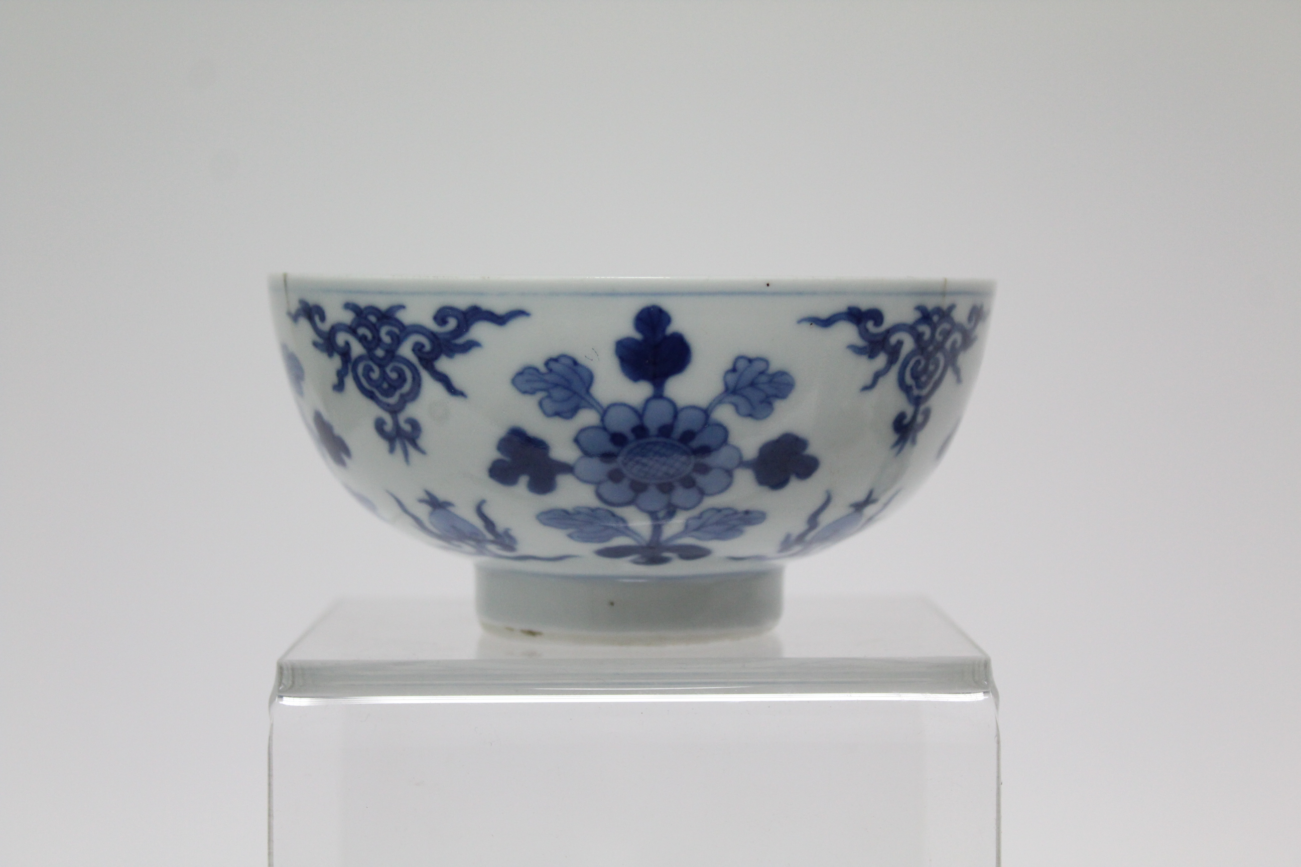 A Chinese blue & white porcelain deep bowl with lotus rim, painted with panels of deer amongst - Image 17 of 24