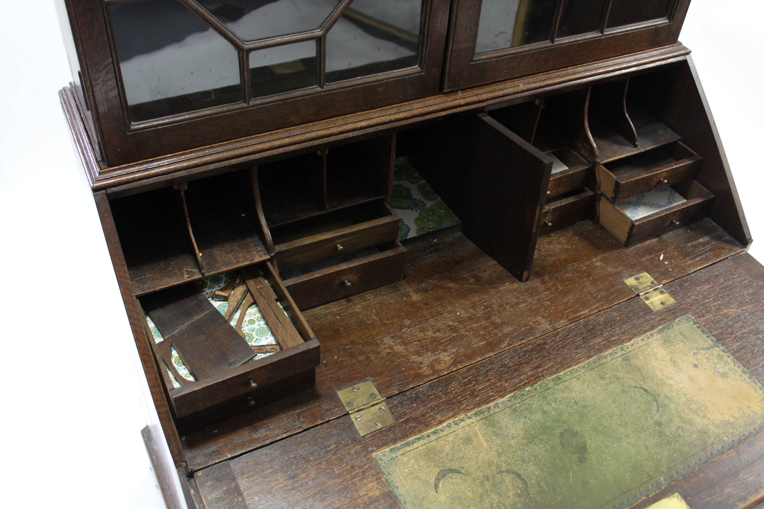 An 18th century oak bureau-bookcase, the upper part fitted three adjustable shelves enclosed by pair - Image 4 of 6