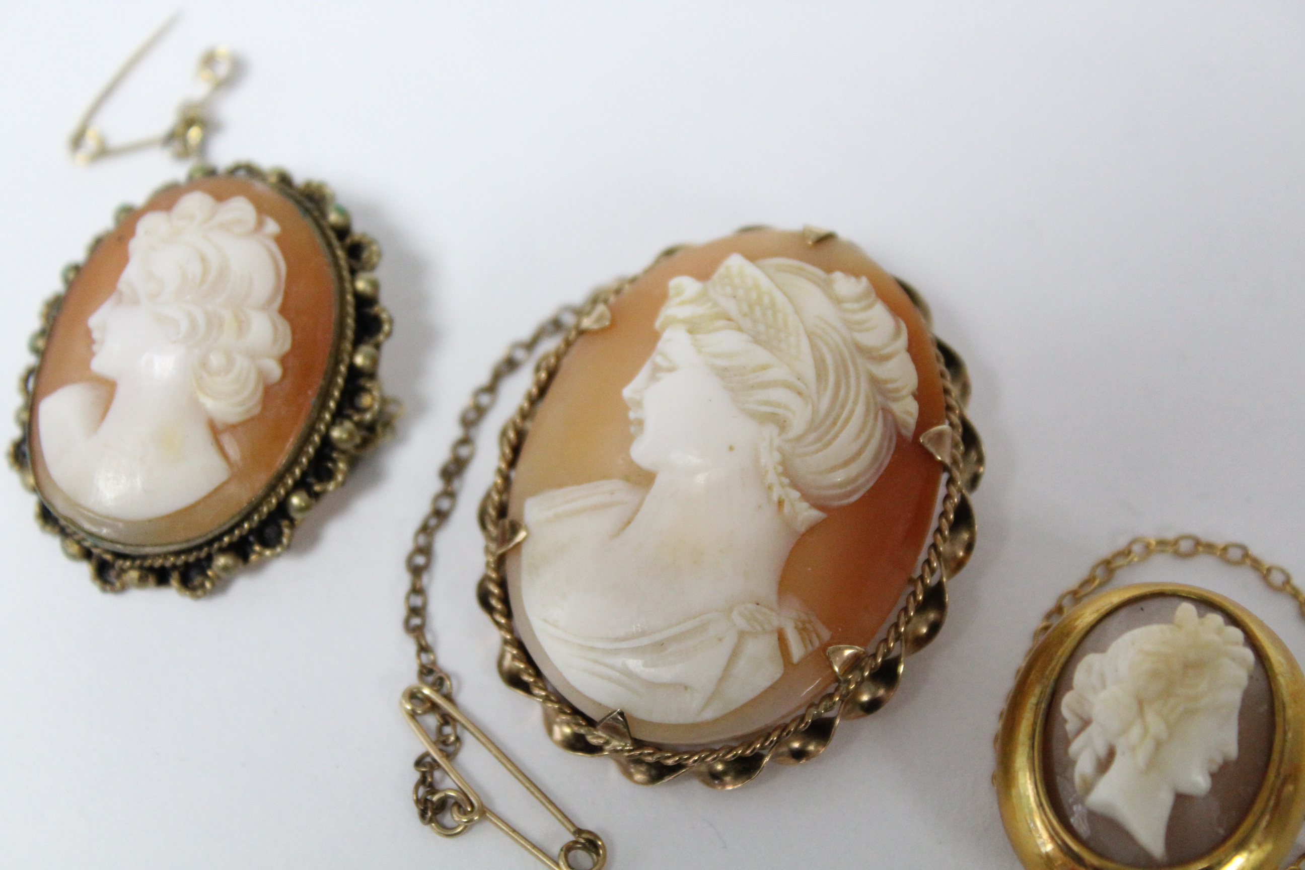 A carved shell oval cameo brooch depicting a female portrait, in 9ct. gold mount, 1½” x 1”; & two - Image 2 of 5