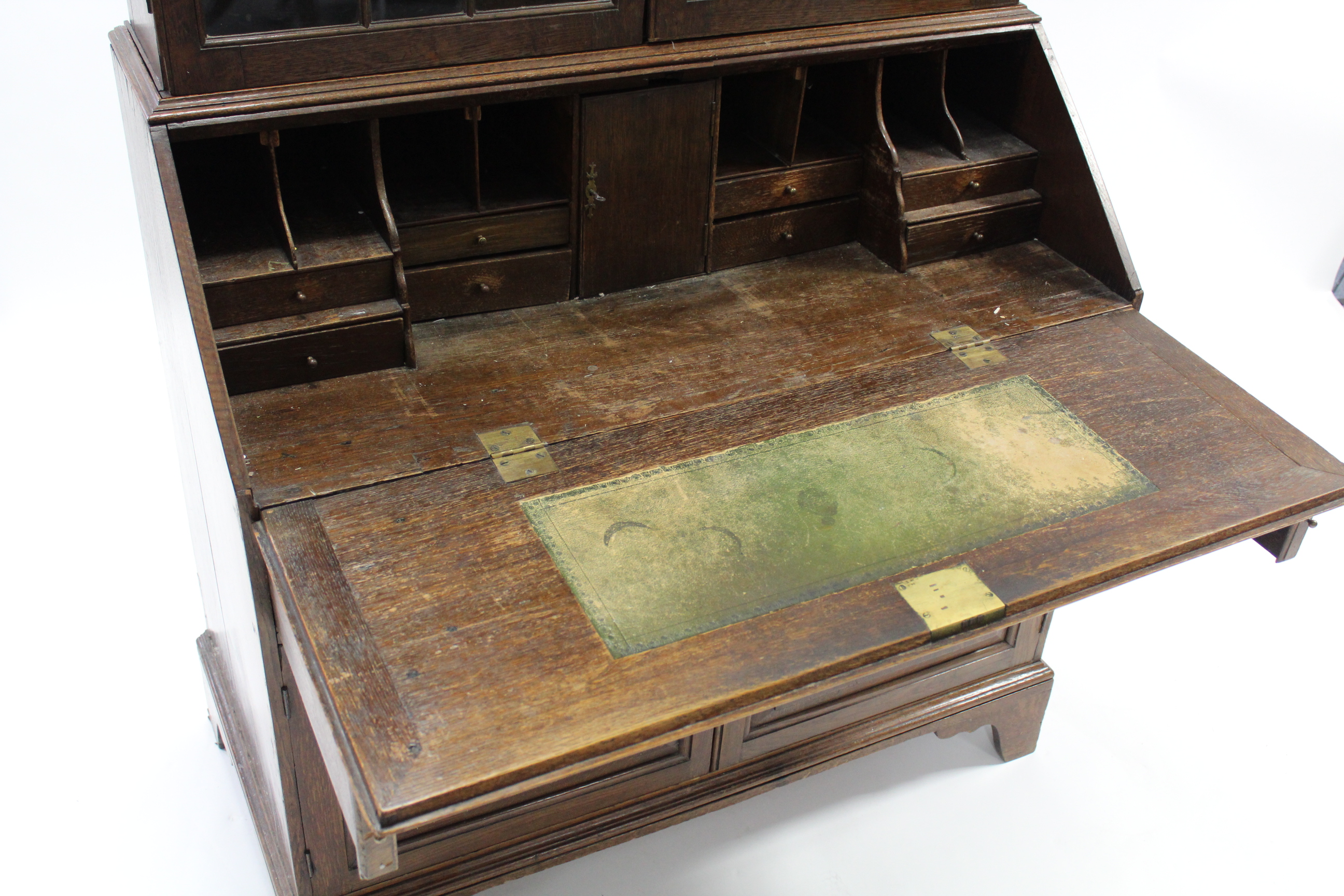 An 18th century oak bureau-bookcase, the upper part fitted three adjustable shelves enclosed by pair - Image 3 of 6