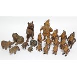 A collection of nineteen various Black Forest carved wooden models, comprising seven bears, & twelve