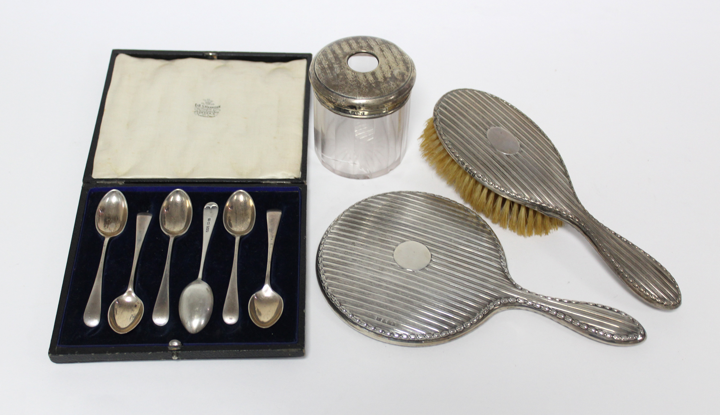 A set of six silver teaspoons in fitted case, Sheffield 1918 by J. Rodgers & Co.; together with a