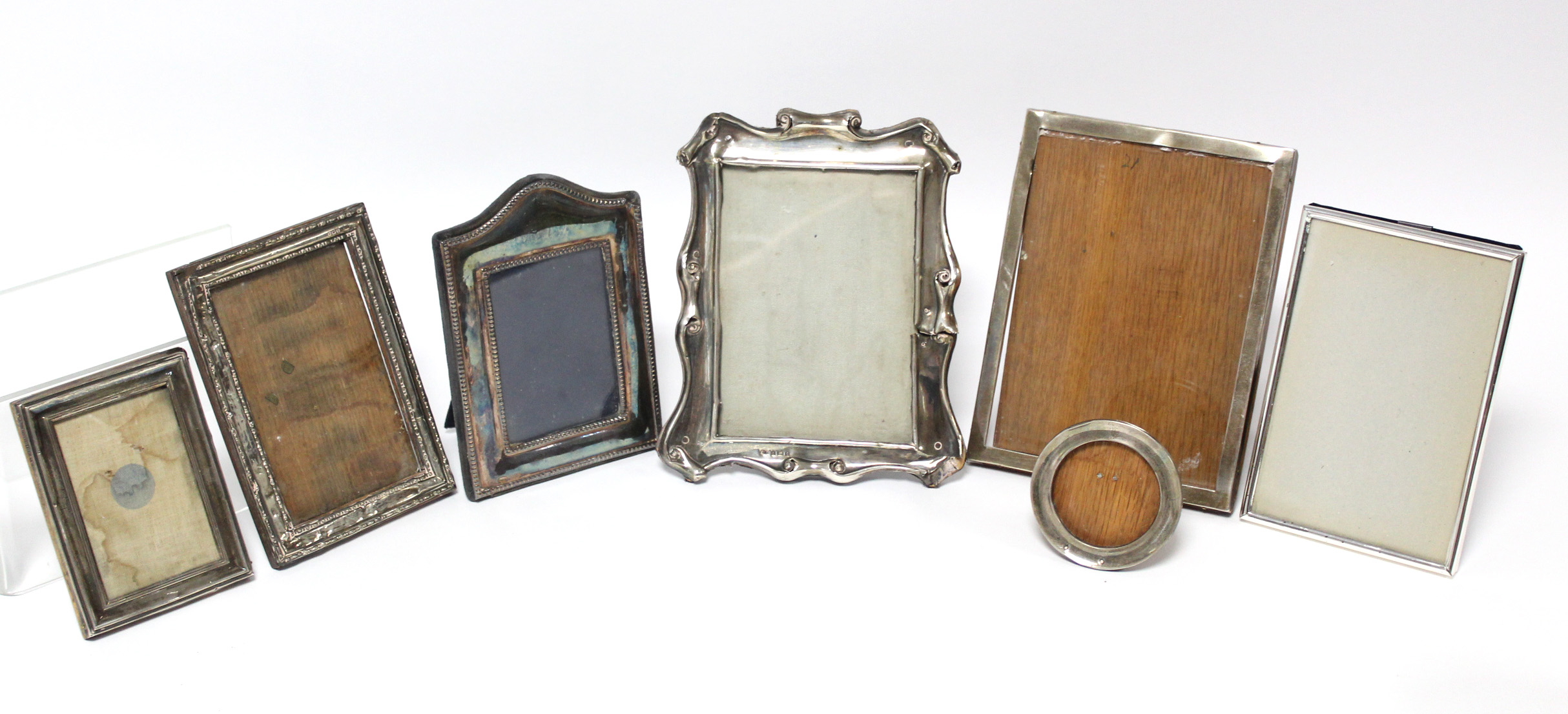 Five various rectangular photograph frames; & a small circular photograph frame, w.a.f.