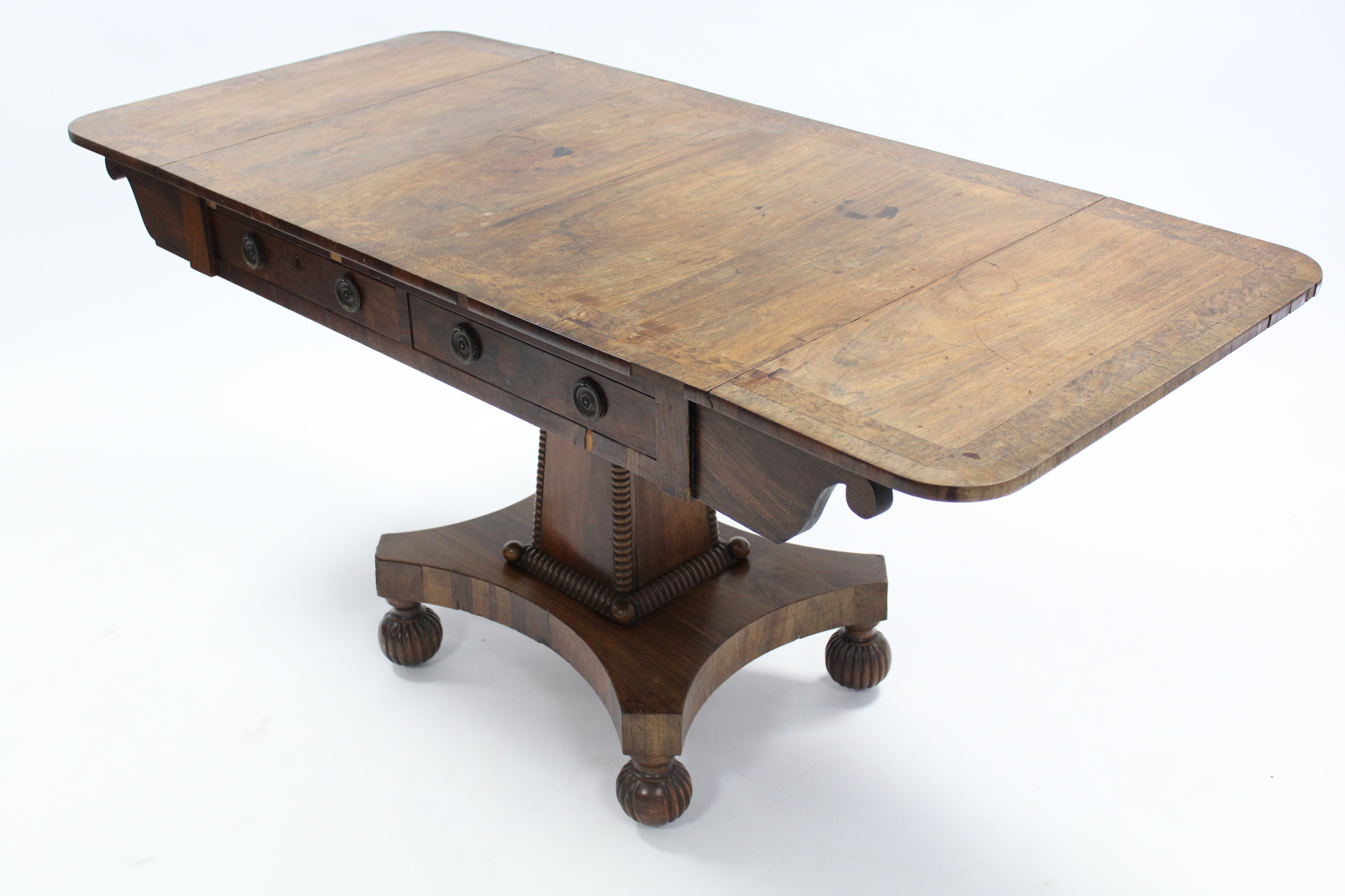 A regency rosewood sofa table with burr-yew & rosewood crossbanding, fitted two frieze drawers, on